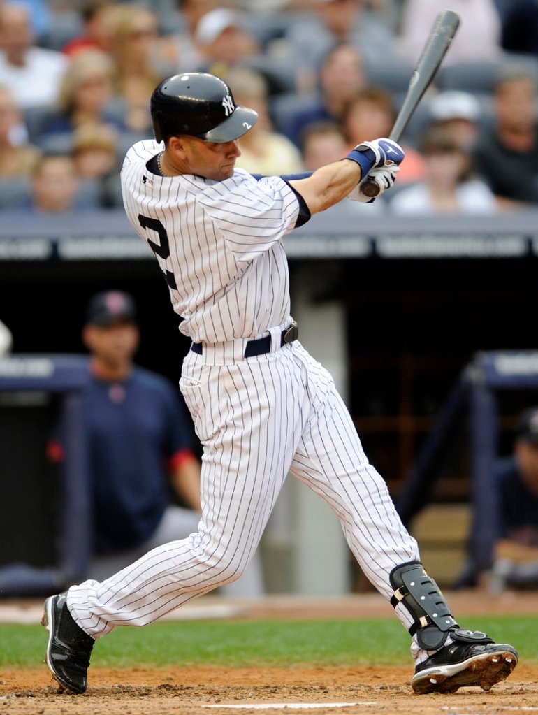 Derek Jeter follows through on a three-run homer in the second inning against Jon Lester and the Red Sox on Saturday at Yankees Stadium. Boston lost, 9-1.