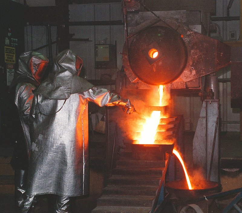 Workers make gold ingots at a facility in Nevada, where much of the nation’s gold is mined. Many mining communities, such as Elko, have gotten an economic boost from the recent runup in gold prices, but fear the good times will not last. The city of Elko is putting off hiring, though newcomers are straining services.