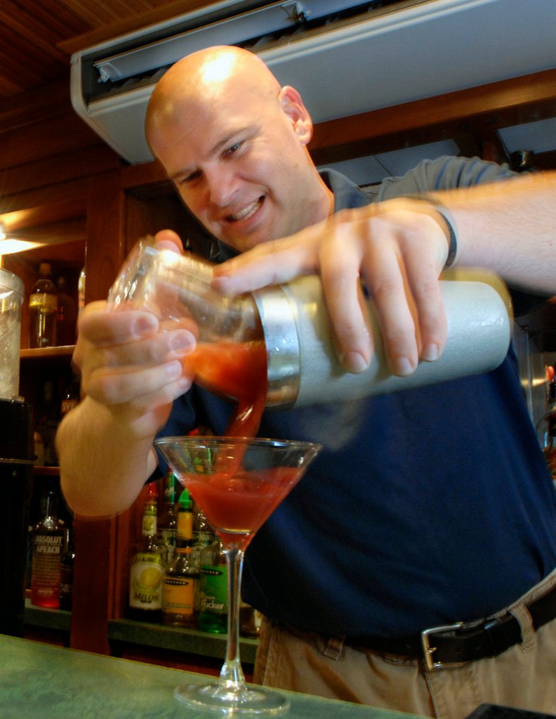 Charles Nedzbala, a bartender at the West Meadow Pub at the Meadowmere Resort in Ogunquit, uses his own lobster vodka to make a Bloody Mary.