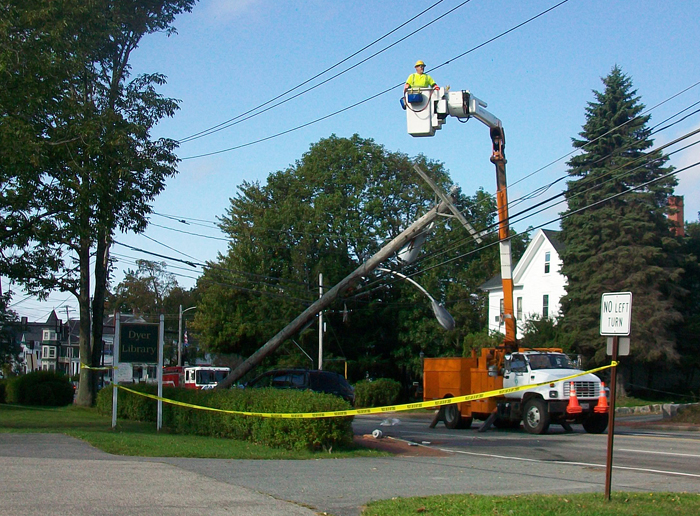 A crew from CMP works to replace a utility pole that was hit by a car on Main Street in Saco this morning. Contributed photo by Jessica Skwire Routhier.