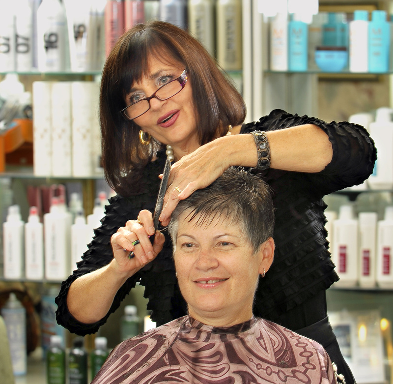 Gordon Chibroski/Staff Photographer Janet Thiboutot, owner of As You Wish, provides Gail Sanborn, a regular client, with her monthly haircut at Thiboutot’s salon on Woodford Street in Portland.