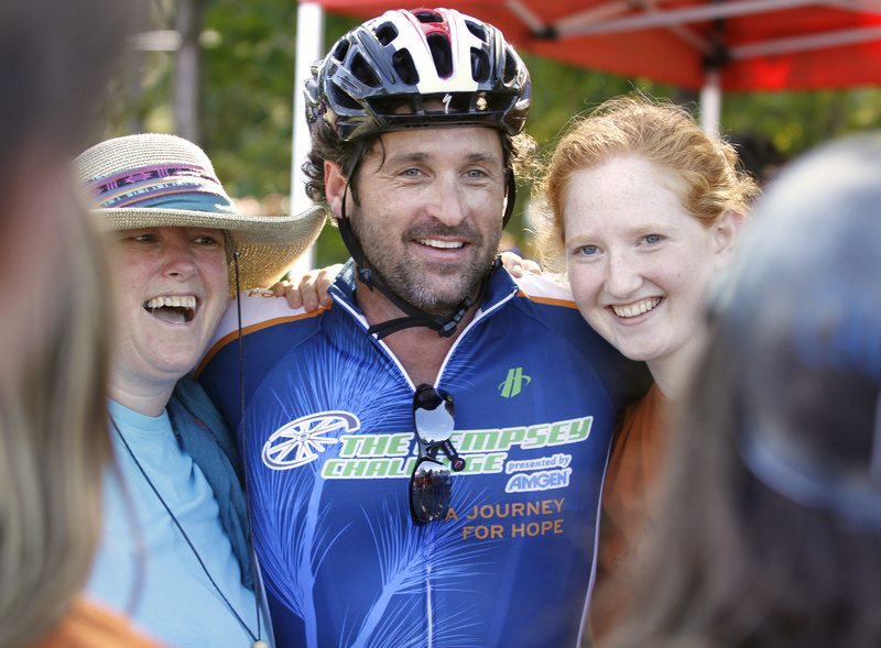 Actor Patrick Dempsey poses for a photo with Shawne McCord, left, and her daughter Lia Wellen, 17, both volunteers from Freeport, at a rest stop in Mechanic Falls. Dempsey stopped periodically along the bike route to meet locals, volunteers and fellow bikers, sign autographs and pose for photographs today.