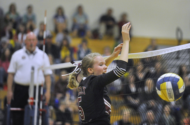 Ellie Weickert of Greely makes a block Friday night during a match against Falmouth. The Rangers swept the Yachtsmen in three games to close out the regular season at 14-0.