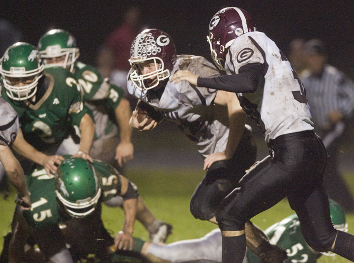 Brad Turnbaugh of Gorham finds a hole and heads to the end zone on a 93-yard run Friday night – part of the 16 combined touchdowns in a 63-47 victory against Massabesic. Gorham gained 607 yards rushing and other than three fumbles, scored on each possession.