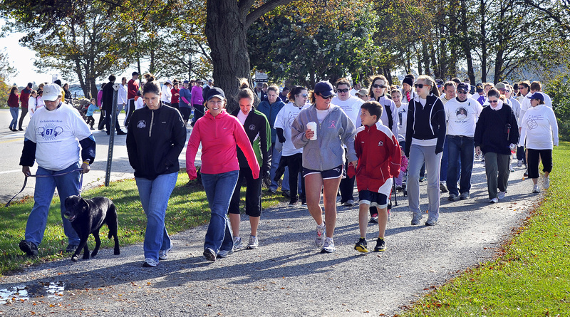 Participants start the Out of Darkness walk Saturday at Back Cove in Portland to benefit the American Foundation for Suicide Prevention. The walk also serves to support those affected by a suicide.