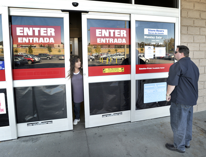 An unidentified store employee today directs vendor David Lamb of Blue Rock Industries to a back entrance at the now-closed Lowe's in Biddeford.