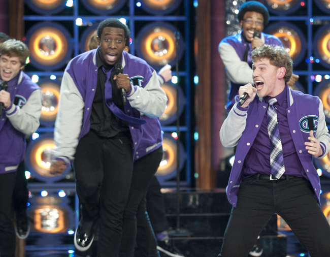The Dartmouth Aires, featuring Michael Odokara-Okigbo, left, of Portland, perform on Monday’s episode of NBC’s “The Sing-Off.” The winning group will be announced Nov. 28.