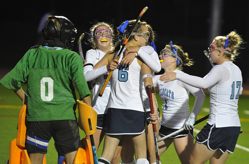 York High’s Taylor Simpson is congratulated by Shelby Spencer, 6, Liz Fiorentino, 1, and Victoria Stocks, 17, after scoring the only goal in Tuesday’s 1-0 win at Hill Stadium in Saco. Mountain Valley goalie Emily Gallant, who had an excellent game with 14 saves, looks on at left. York will play Belfast in the state final Saturday.