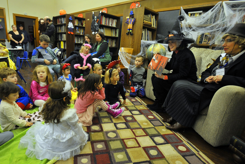 State Senator Lisa Baker reads to children at the Nuangola Library with the Librarian Lina Santomauro. Children attending the Halloween themed reading were treated to activities and a snack as well as stories. 10/29/2011 Aimee Dilger/The Times Leader