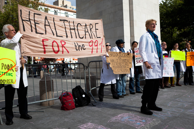 Health care workers stand in support of the Occupy Wall Street demonstration in New York on Saturday. The movement’s lack of leaders has allowed varied participation.