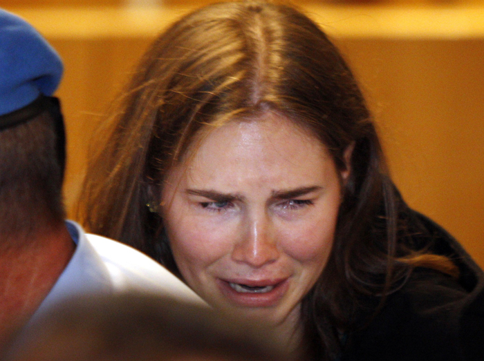 Amanda Knox breaks down in tears after hearing the verdict overturning her conviction of murdering her roommate today.