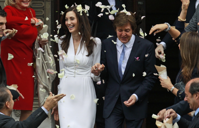 Former Beatle Paul McCartney and American heiress Nancy Shevell exit Marylebone Town Hall in central London after they were married today. Shevell, 51, is McCartney's third wife. They were engaged earlier this year. The couple met in the Hamptons in Long Island, N.Y., shortly after the singer's divorce from Heather Mills in 2008.