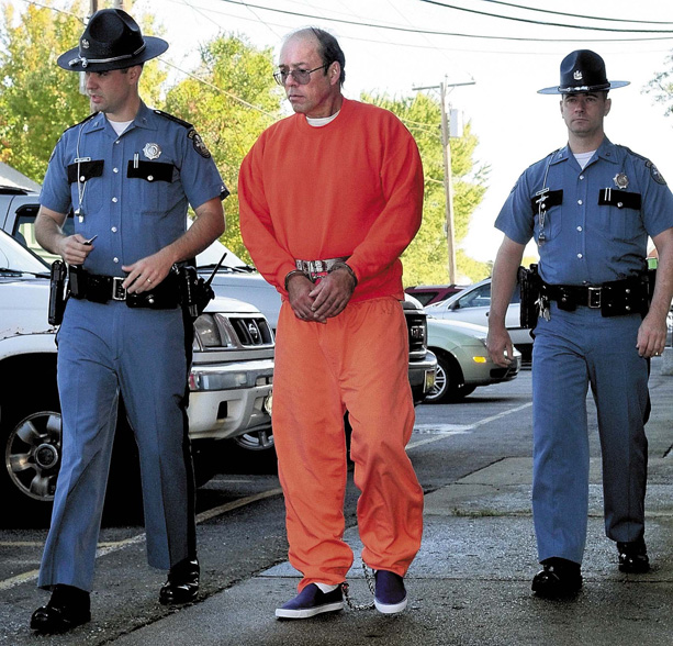 Maine state troopers lead Jay Mercier from Somerset Superior Court in Skowhegan today where he pleaded not guilty of murdering Rita St. Peter.