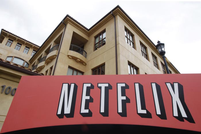 Netflix's third-quarter earnings rose 65 percent even though the video subscription service suffered the biggest customer losses in its history.