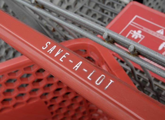 Grocery carts are stacked outside the Save-a-Lot grocery store in Northfield, Ohio. Recent reports show consumers have boosted their spending on retail goods by the most since March.