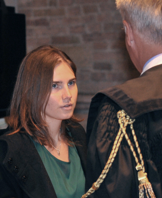 Amanda Knox talks with her lawyer Carlo Dalla Vedova upon arrival for an appeal hearing at the Perugia court, central Italy, today.