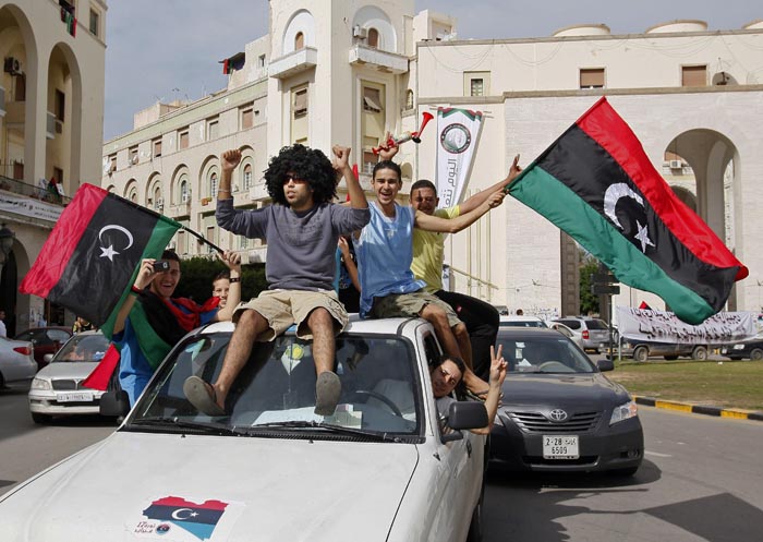 Libyans in Tripoli celebrate Moammar Gadhafi's death today.