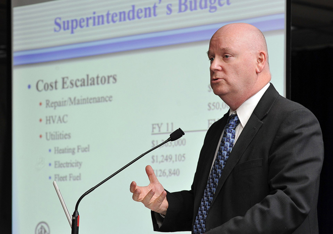 In this March 1, 2011, photo, Portland Schools Superintendent Jim Morse explains his 2011-2012 proposed budget to school committee members, teachers, staff and the public at Casco Bay High School.