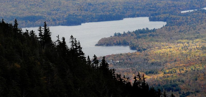 An autumn vista from Tumbledown Mountain, near Weld, includes Webb Lake below and miles of vibrant trees, making it a favorite with many hikers.