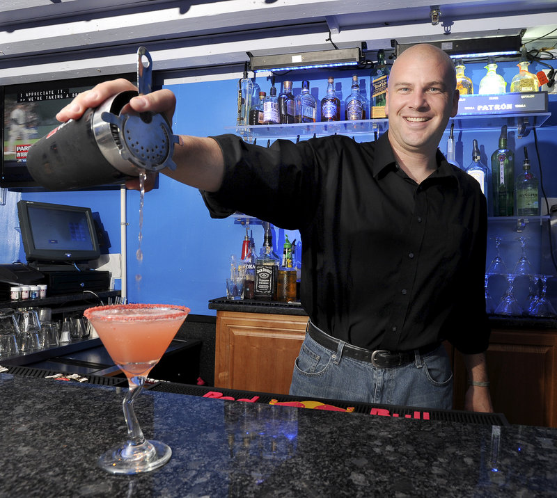Bartender Charles Nedzbala makes a ultimate cosmo at FortiFem Martini Lounge in Portland.
