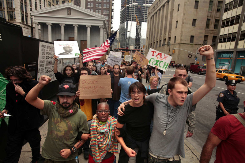 Occupy Wall Street protesters march through the streets of lower Manhattan on Sept. 29. A reader says specific actions are needed.
