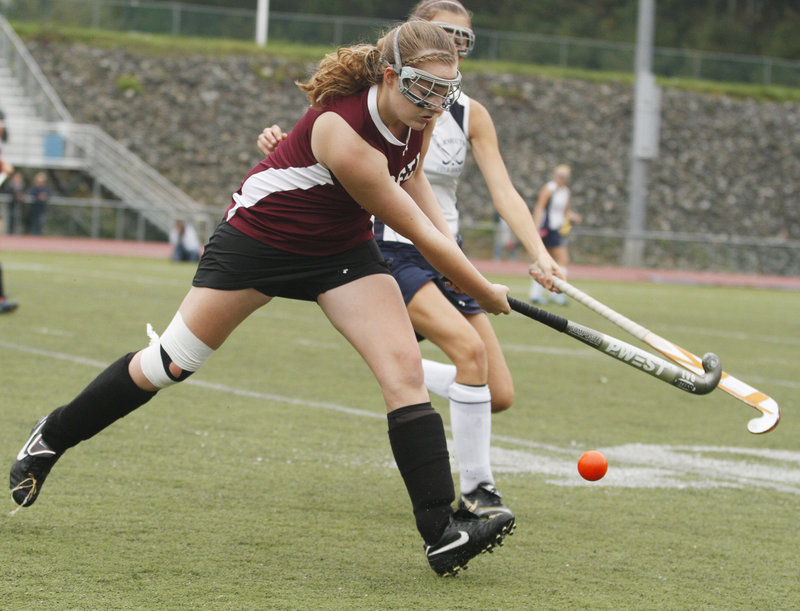 Maggie Norton of Greely keeps her eyes on the ball while attempting to hold off a Yarmouth defender during their Western Maine Conference game at Yarmouth High.