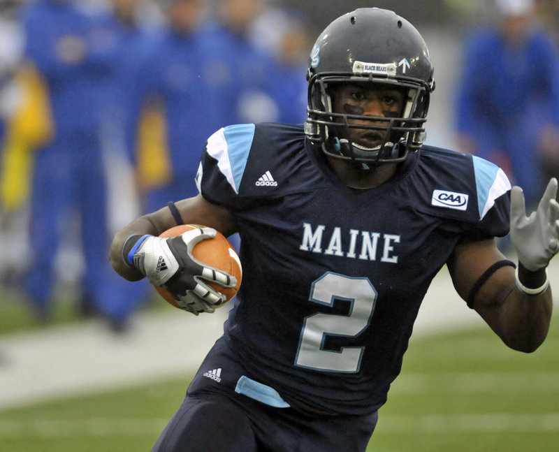 Pushaun Brown looks downfield on his way to a 26-yard touchdown run in the first quarter, one of three TD runs for Brown to help Maine win its conference opener.