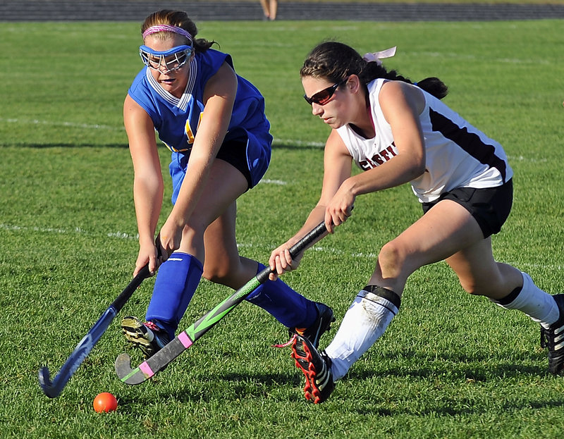 Kristina Morton of Lake Region, left, and Julia Maine of Greely compete for the ball Monday during Greely’s 3-1 victory at home in field hockey. The Rangers improved their record to 8-3. Lake Region is 4-4-2.