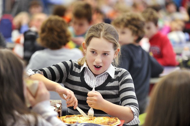 Wentworth Intermediate School student Grace Murphy enjoys a pizza in this February file photo. Those interested in a plan to replace the school can meet soon to discuss it, a reader says.
