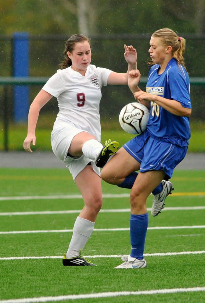 Maddie Skop of Falmouth, right, blocks a pass by Livvy Dimick of Freeport during Falmouth’s 6-1 victory in a Western Maine Conference game Tuesday.