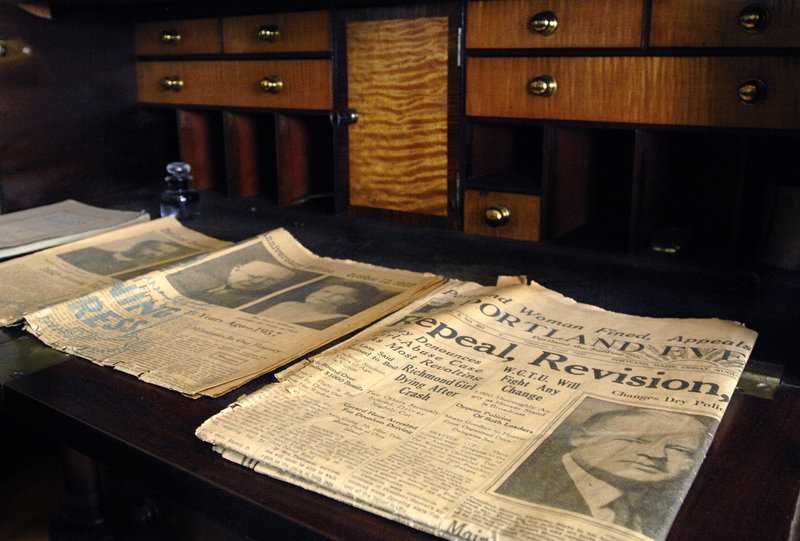 Newspapers displayed in a study at the Neal Dow House in Portland show headlines about Prohibition’s repeal in 1933.