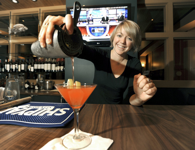 Bartender Kelly Franklin pours a strawberry basil lemonade cocktail at the Falmouth Sea Grill in Falmouth.