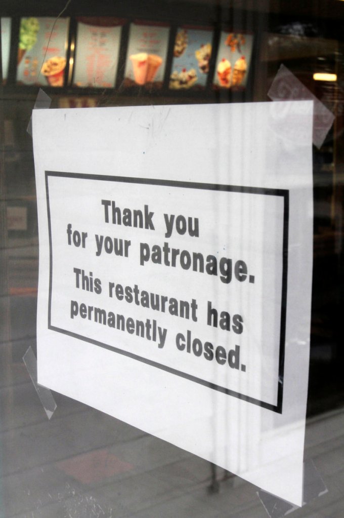 A closed sign is taped to the door of the Friendly’s restaurant in Freeport Wednesday. The parent company of the chain is filing for Chapter 11 bankruptcy protection.