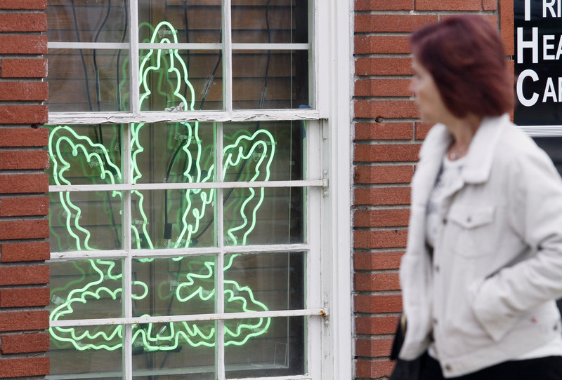A neon marijuana leaf advertises a medical marijuana provider in the Sherman Oaks section of Los Angeles.