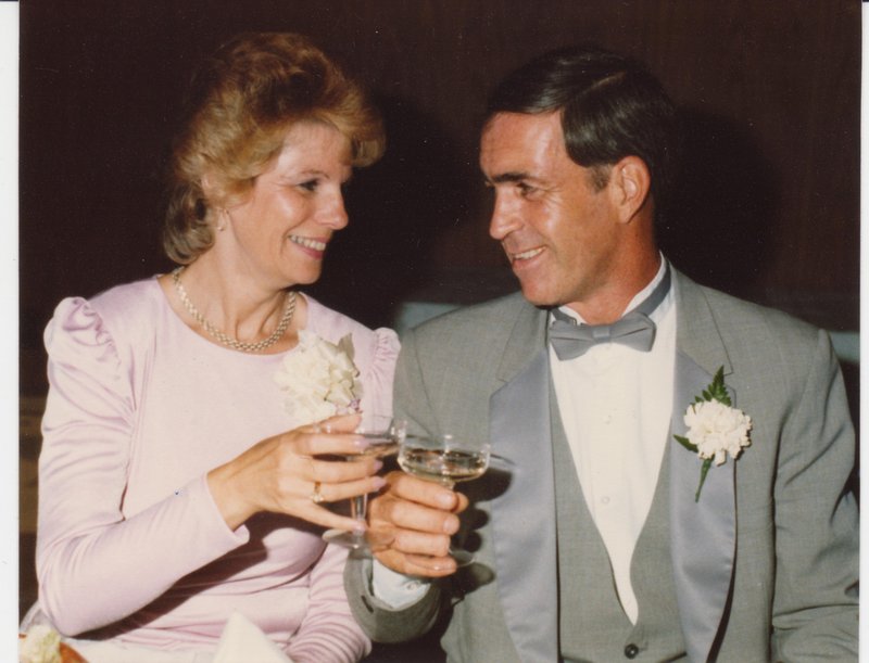 Billy Lambert and his wife, Cecelia, share a toast at their daughter's wedding in 1984. Mr. Lambert died Tuesday at age 71.