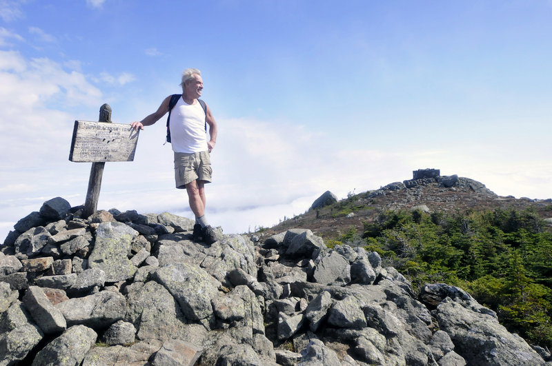 John Christie takes in the view from Avery Peak on Bigelow Mountain earlier this month.
