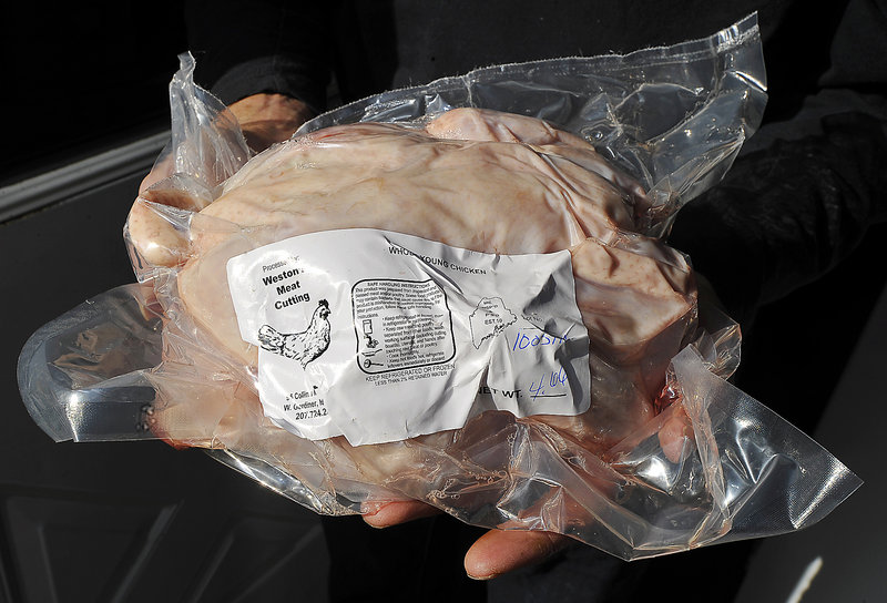 Steve Hoad shows one of his processed chickens, vacuum sealed and ready for sale. It was processed by Weston’s Meat Cutting in West Gardiner, which is the only poultry processing facility in Maine with on-site state inspectors.