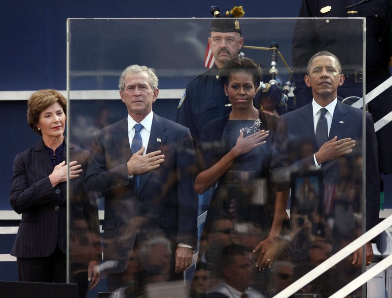 The Bushes and Obamas stand during the national anthem on the 10th anniversary of 9/11.