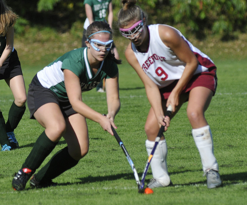 Chloe Williams, left, of Waynflete contends for the ball with Jenny Breau of Freeport during their game at Freeport High.