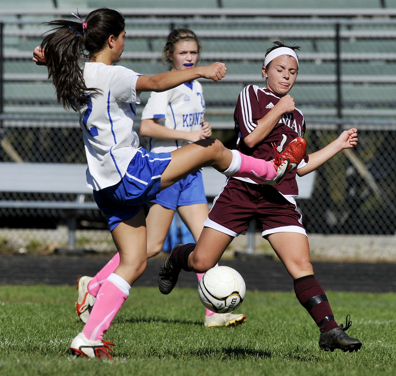 Caroline Hoch of Kennebunk, left, attempts to break up the play Monday as Allie Lurvey of Gorham looks to drive the ball down the field during Gorham’s 6-0 victory in an SMAA schoolgirl soccer game.
