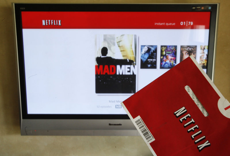 Netflix’s CEO says the company is abandoning its widely panned decision to separate its DVD-by-mail and Internet streaming accounts.