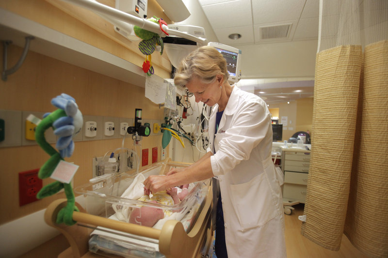 Dr. Brenda Medlin, a pediatrician, examines a baby being treated for dependence on opiates at Maine Medical Center in Portland. “It’s a tough job,” she said of treating drug-affected babies. “But it also very rewarding. There are success stories.”