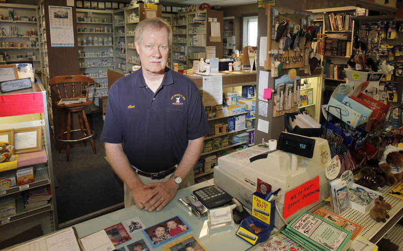 After being robbed twice, in 2006 and then in 2010, Chester Hibbard, owner of E.W. Moore & Son Pharmacy in Bingham, put up signs saying he no longer stocked OxyContin. But another armed robbery took place Sept. 12, just hours after this photo was taken.