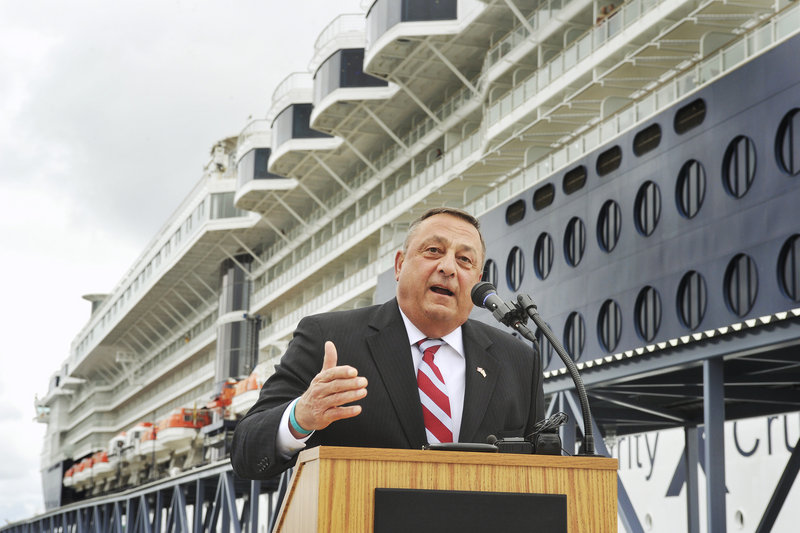 Gov. Paul LePage addresses a gathering at the official opening of the Ocean Gateway Pier II in Portland on Wednesday. The Celebrity Summit cruise ship is in the background.