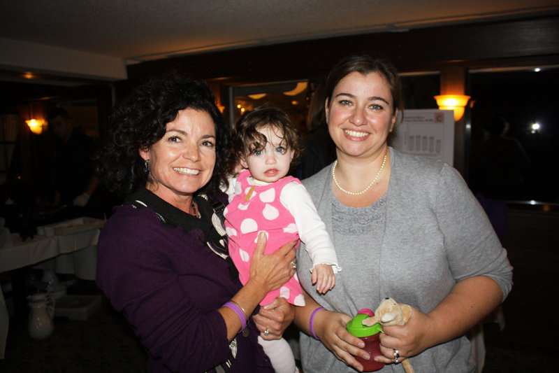 Board member Geri Tamborelli, nursing director at Maine Medical Center’s Family Birth Center and NICU, who is holding NICU graduate Anne-Marie Fay, and March of Dimes Ambassador mom Liz Fay of Naples.