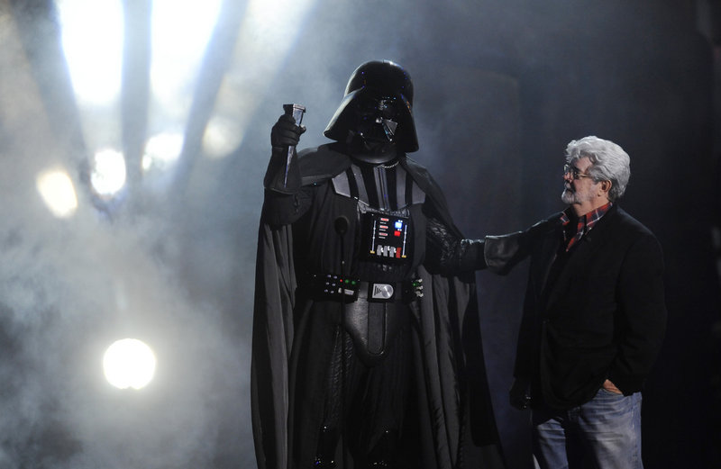 “Darth Vader” accepts the Ultimate Villain award from George Lucas at the 2011 Scream Awards on Saturday.