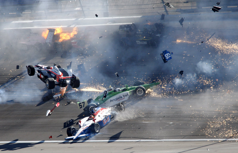 Will Power's car goes airborne as cars crash during the Indy 300 on Sunday. Driver Dan Wheldon, a two-time Indy 500 winner, died in the dramatic accident.