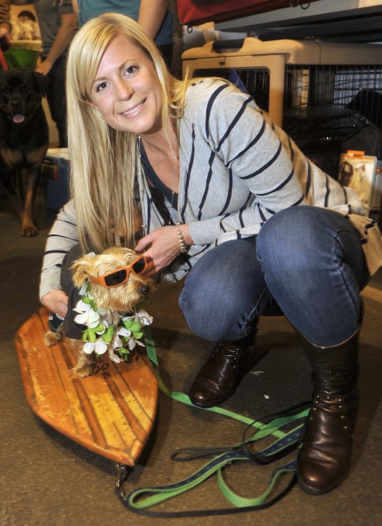 Ashlee Sawyer of Portland with her “surfer dude” dog, Oliver, at last year’s Planet Dog party.