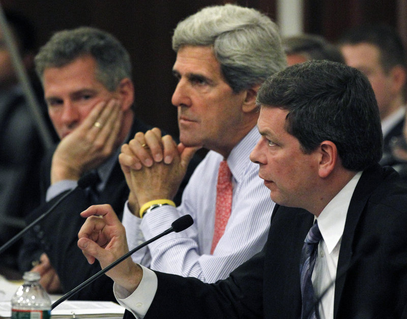 U.S. Sens. Scott Brown, R-Mass., left, John Kerry, D-Mass., center, and Mark Begich, D-Alaska, listen at a hearing Monday in Boston on the state of the Massachusetts fishing industry. Kerry has requested 11 changes in a new fishing management system.