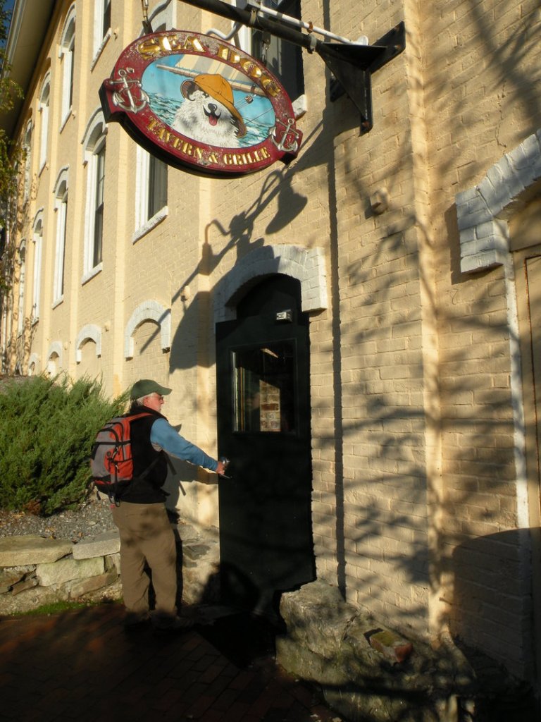 Carey Kish heads inside the Sea Dog brewery in Topsham during a stop on the Maine Beer Trail.